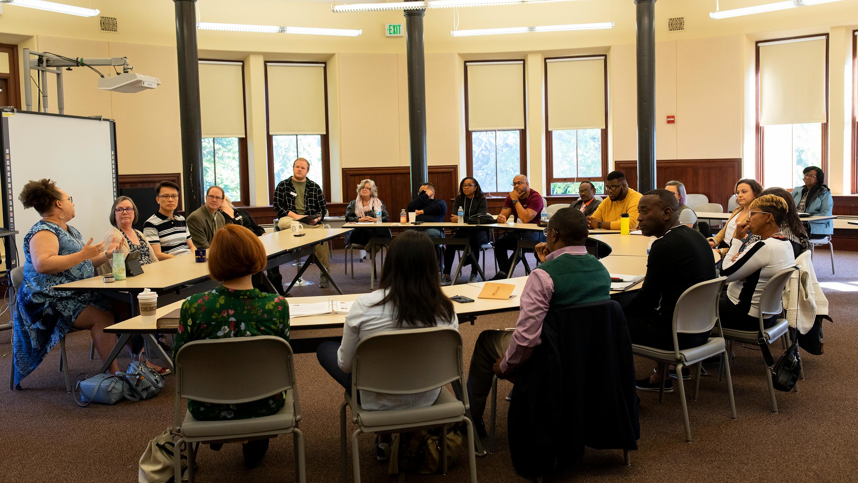 a group of people sitting around a table