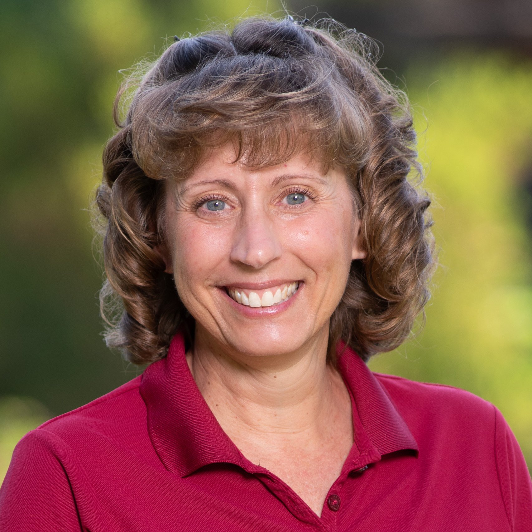 a woman smiling at camera