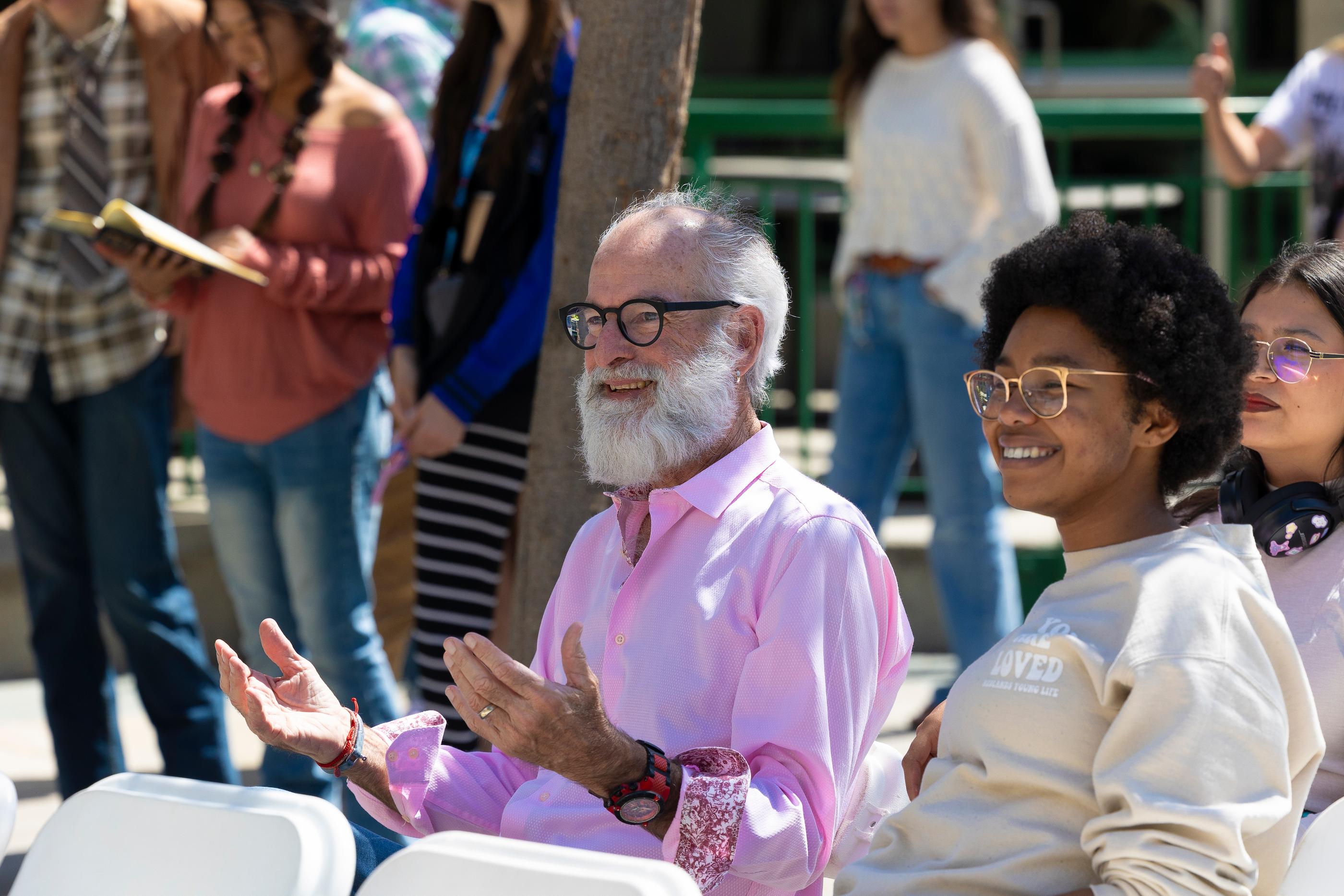 a man and woman clapping