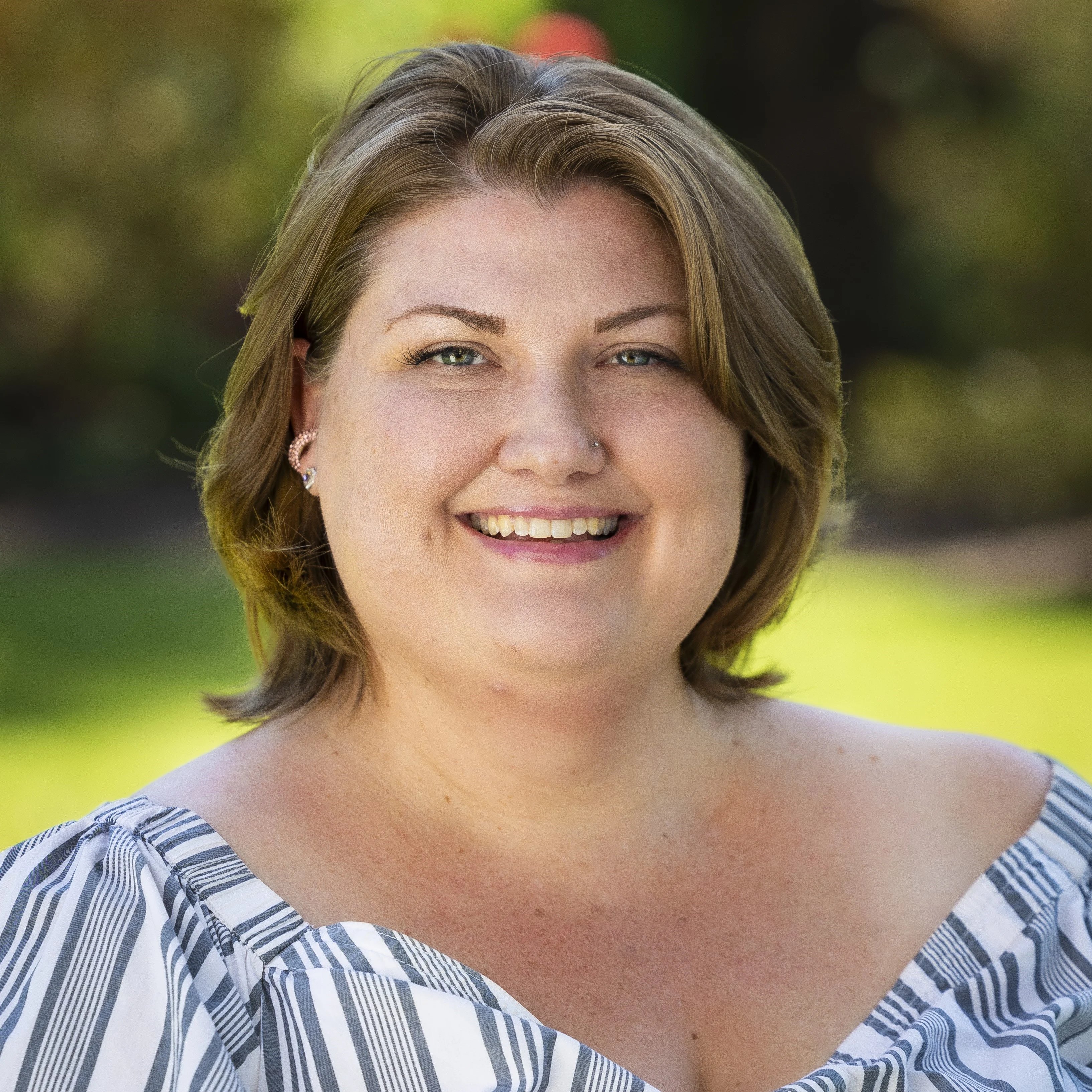a woman smiling at camera