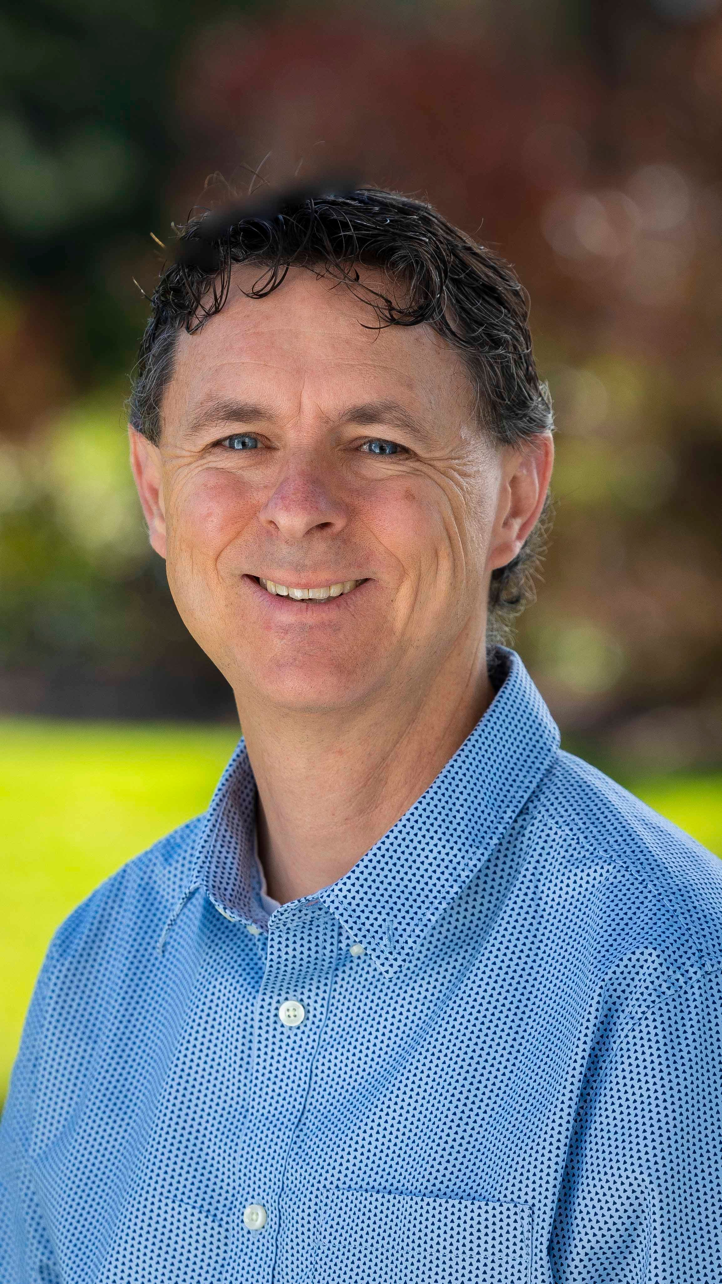 a man smiling for a picture