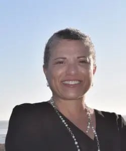 a woman smiling at the camera