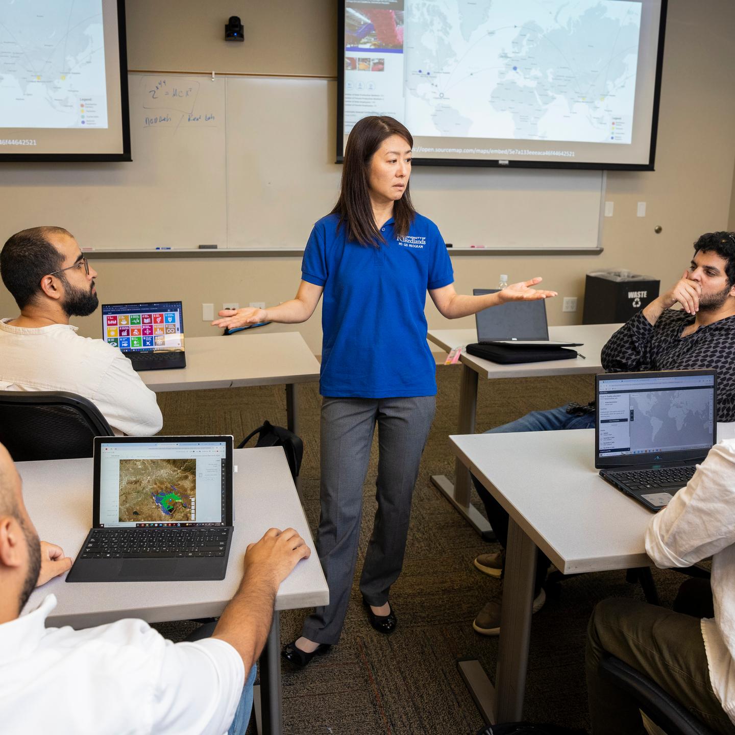 a woman standing in front of a group of people