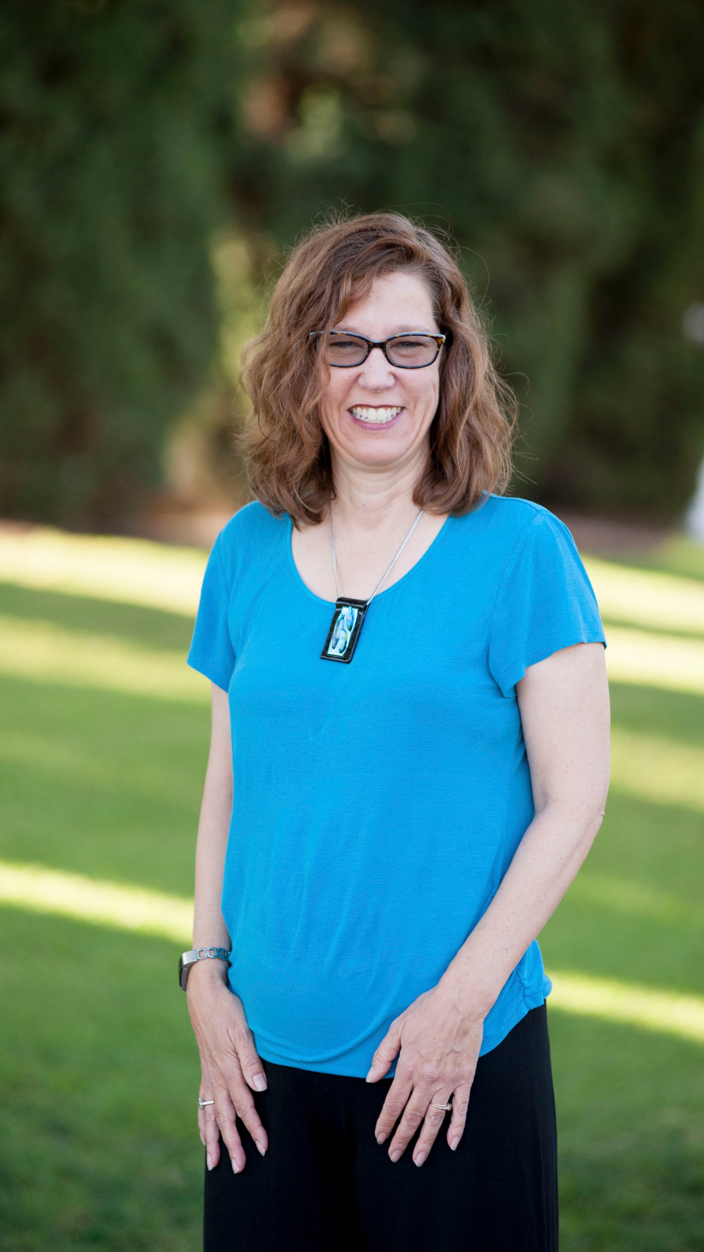 a woman in a blue shirt