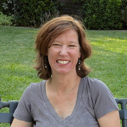a woman sitting on a bench