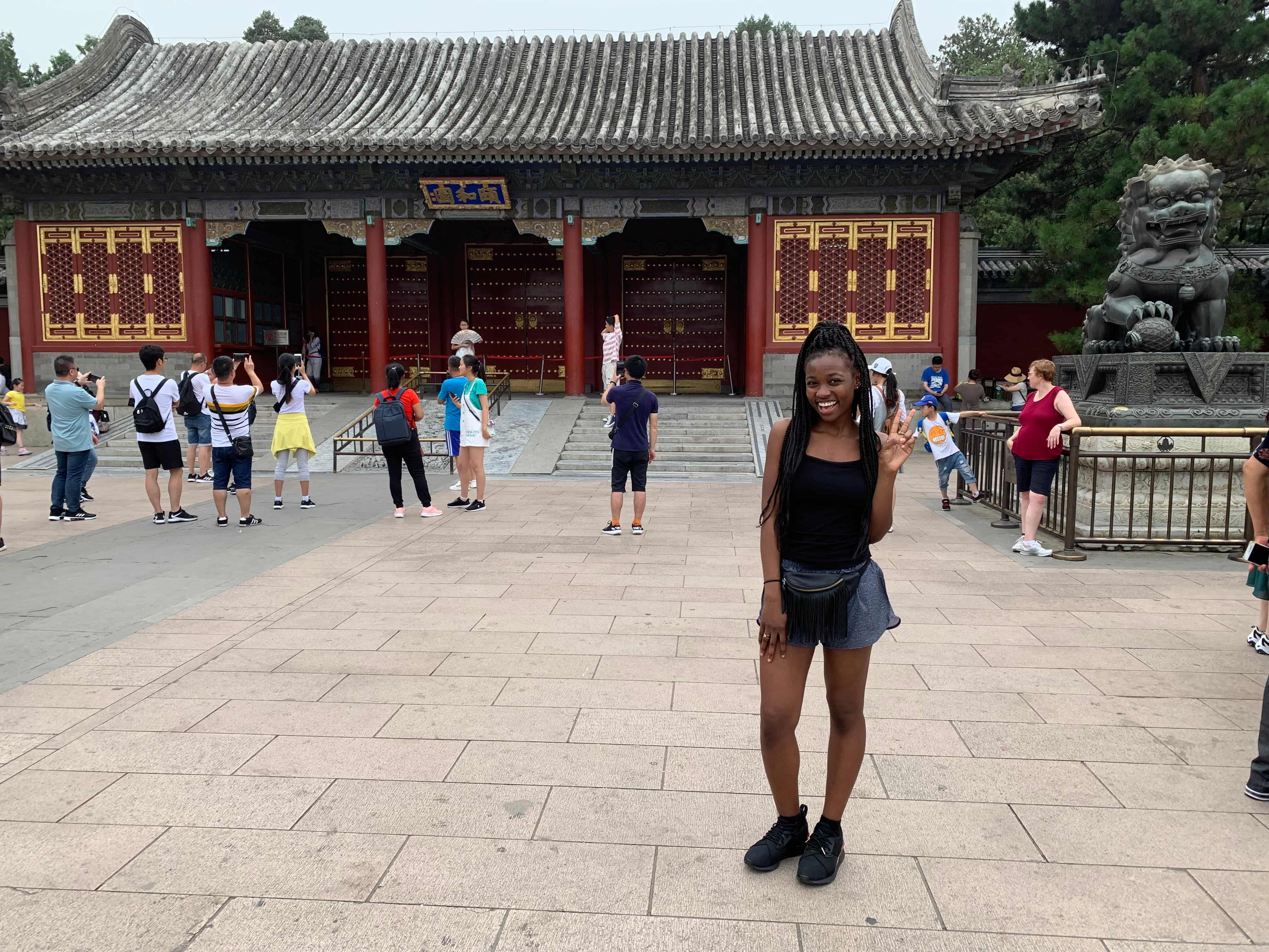 a woman standing in front of a building