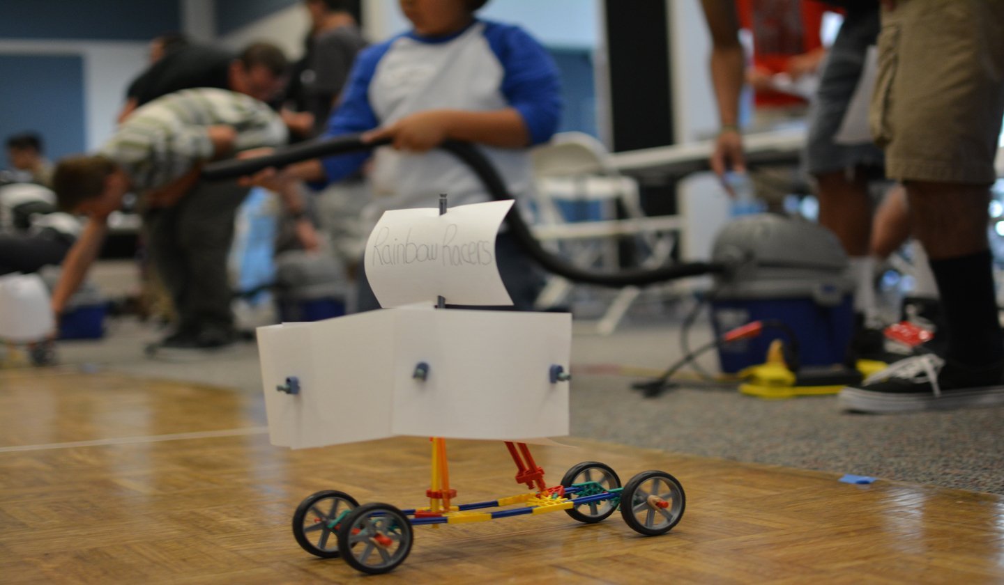 a toy car with a white sign on it