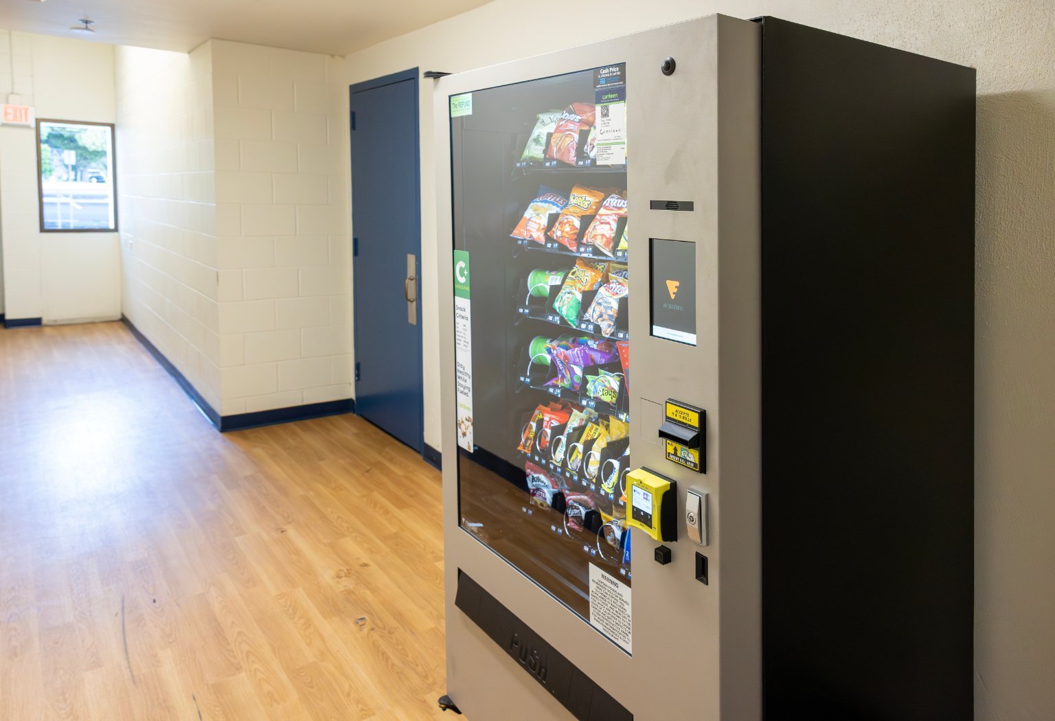 a vending machine in a hallway