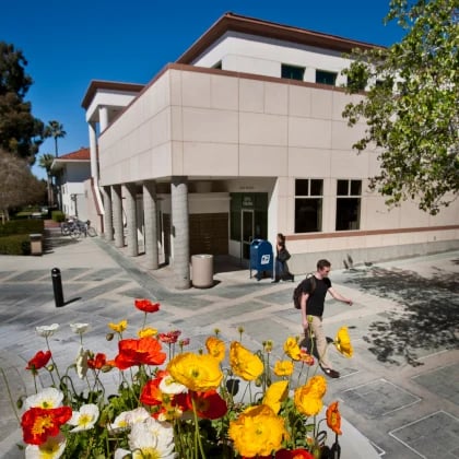 a man walking in front of a building