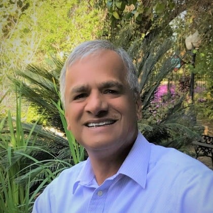 a man smiling for a selfie