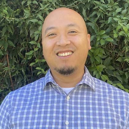 a man smiling at camera