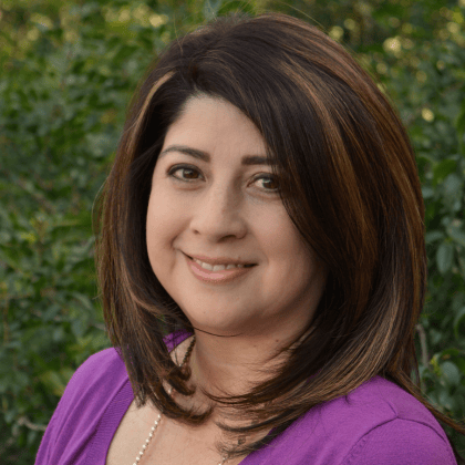 a woman in a purple shirt