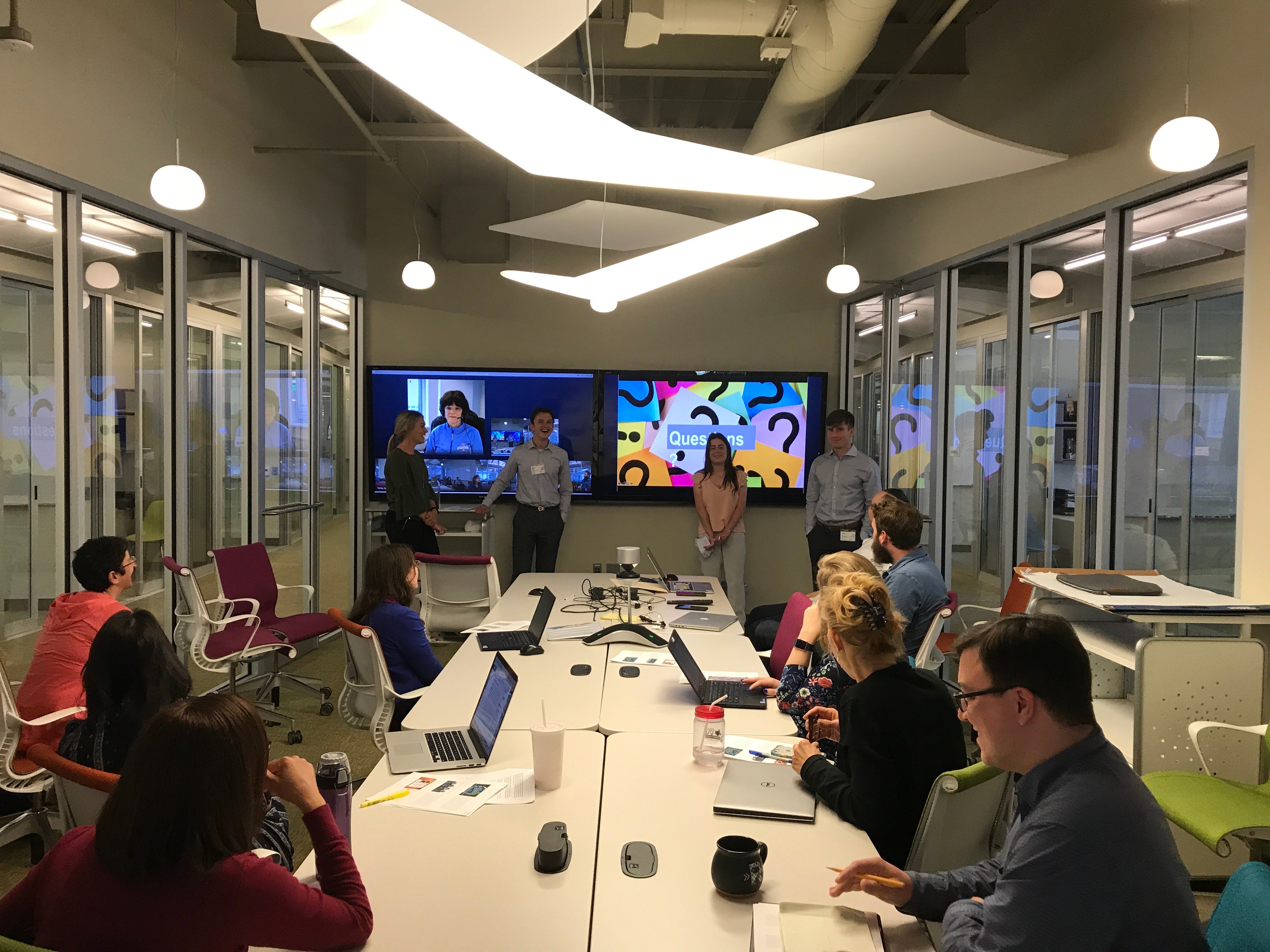 a group of people in a meeting room