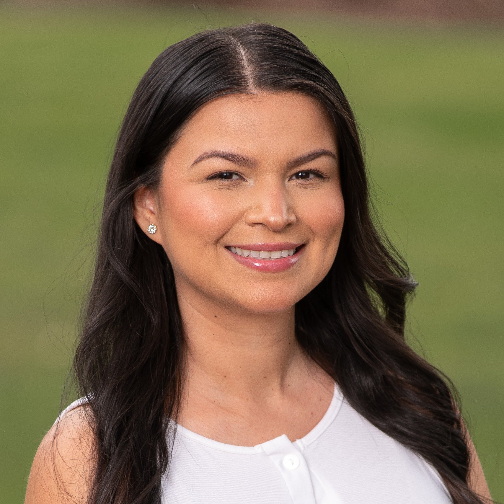 a woman with long hair smiling