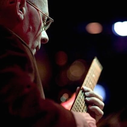 a person playing a guitar