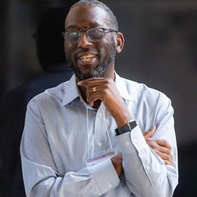 a man with his hand on his chin