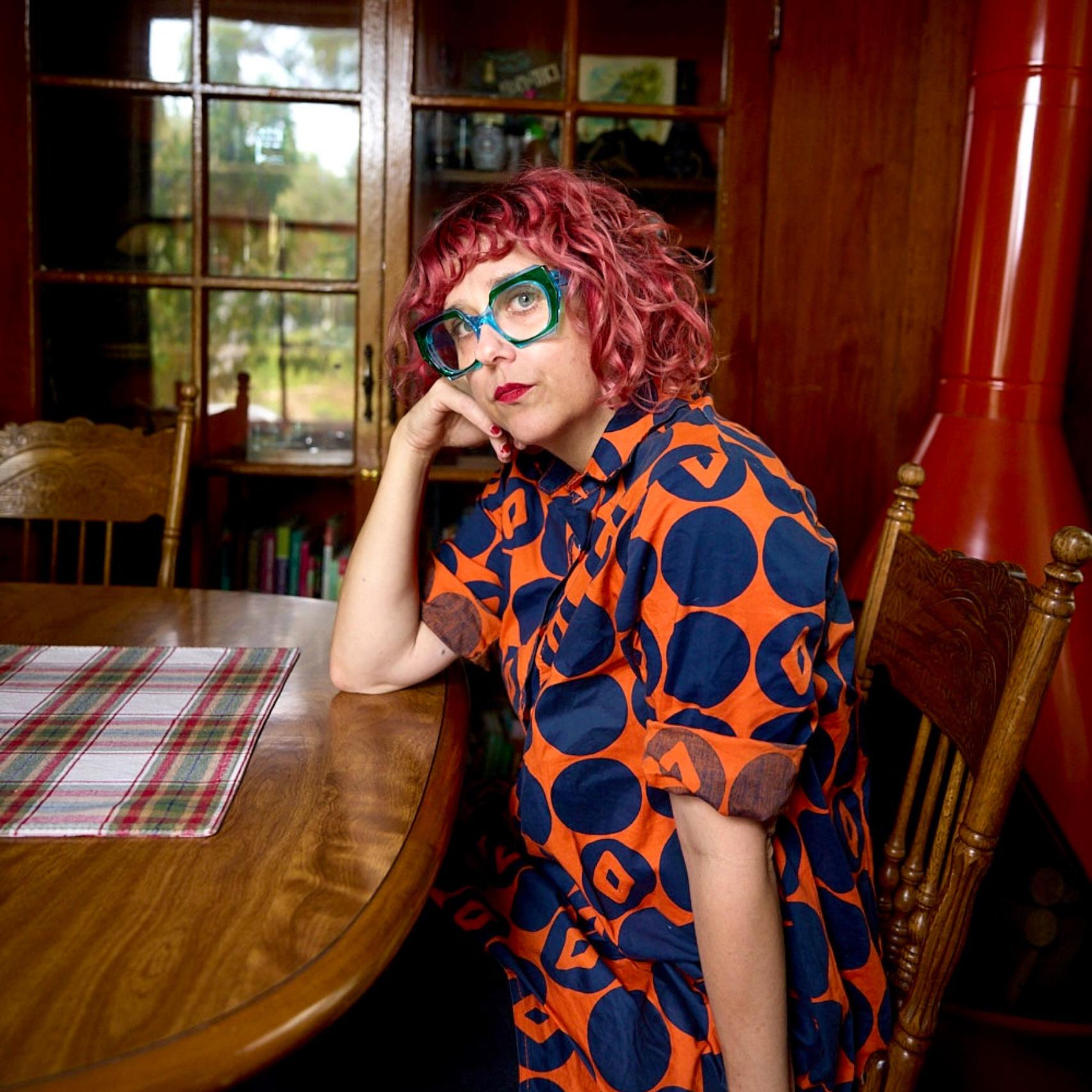 a woman sitting at a table