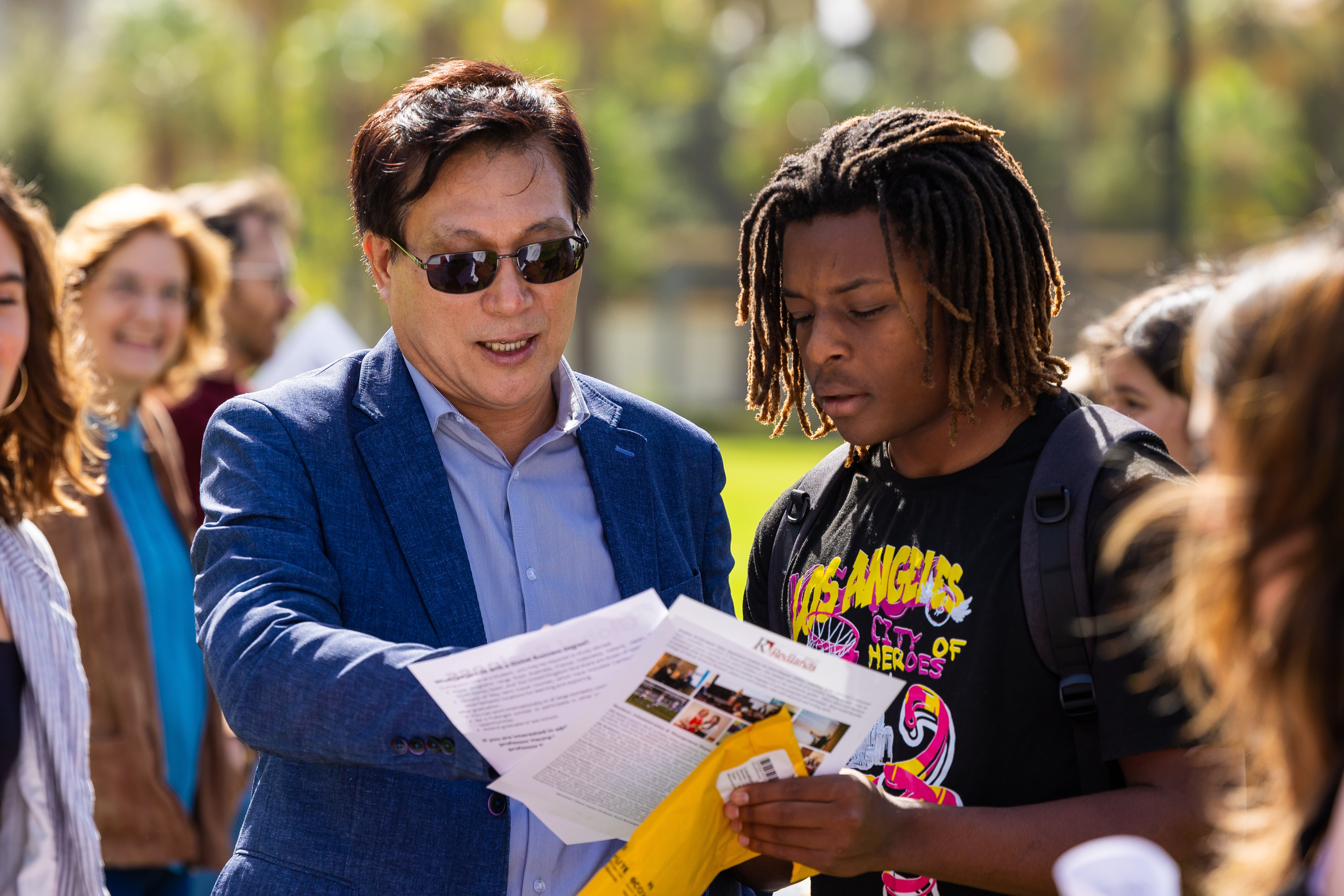 a man looking at a paper