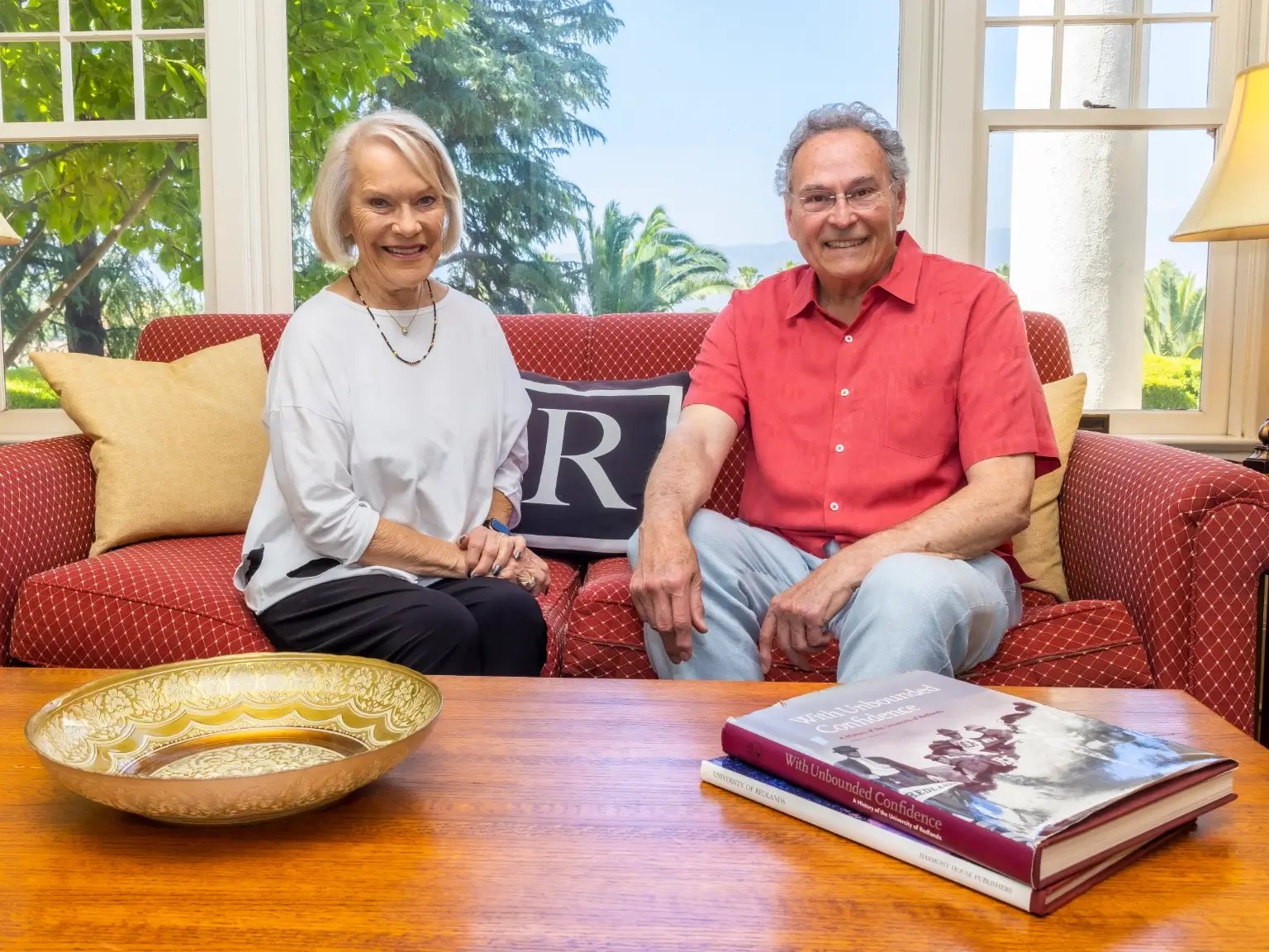 a man and woman sitting on a couch