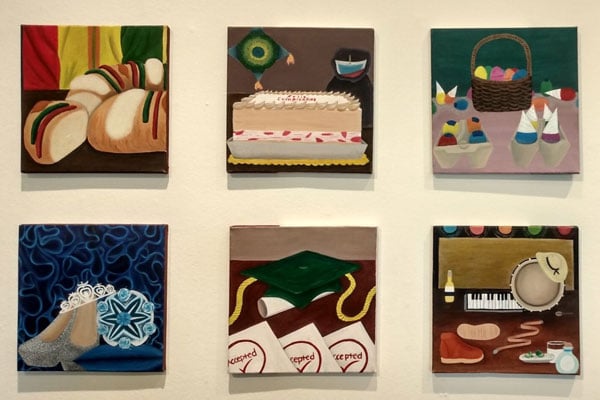 a group of paintings on a wall