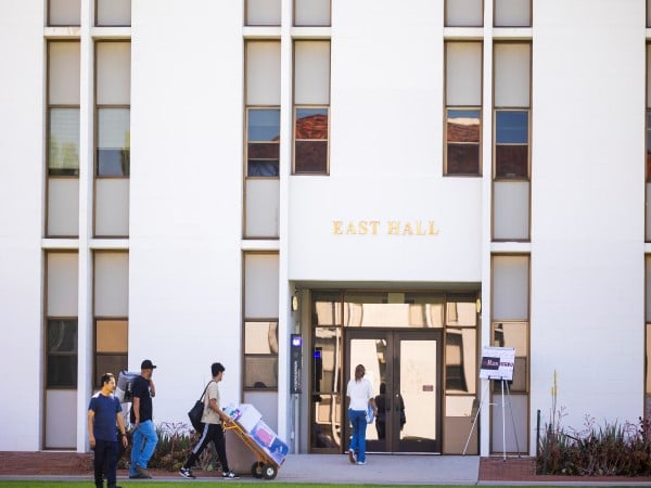 people walking past a building
