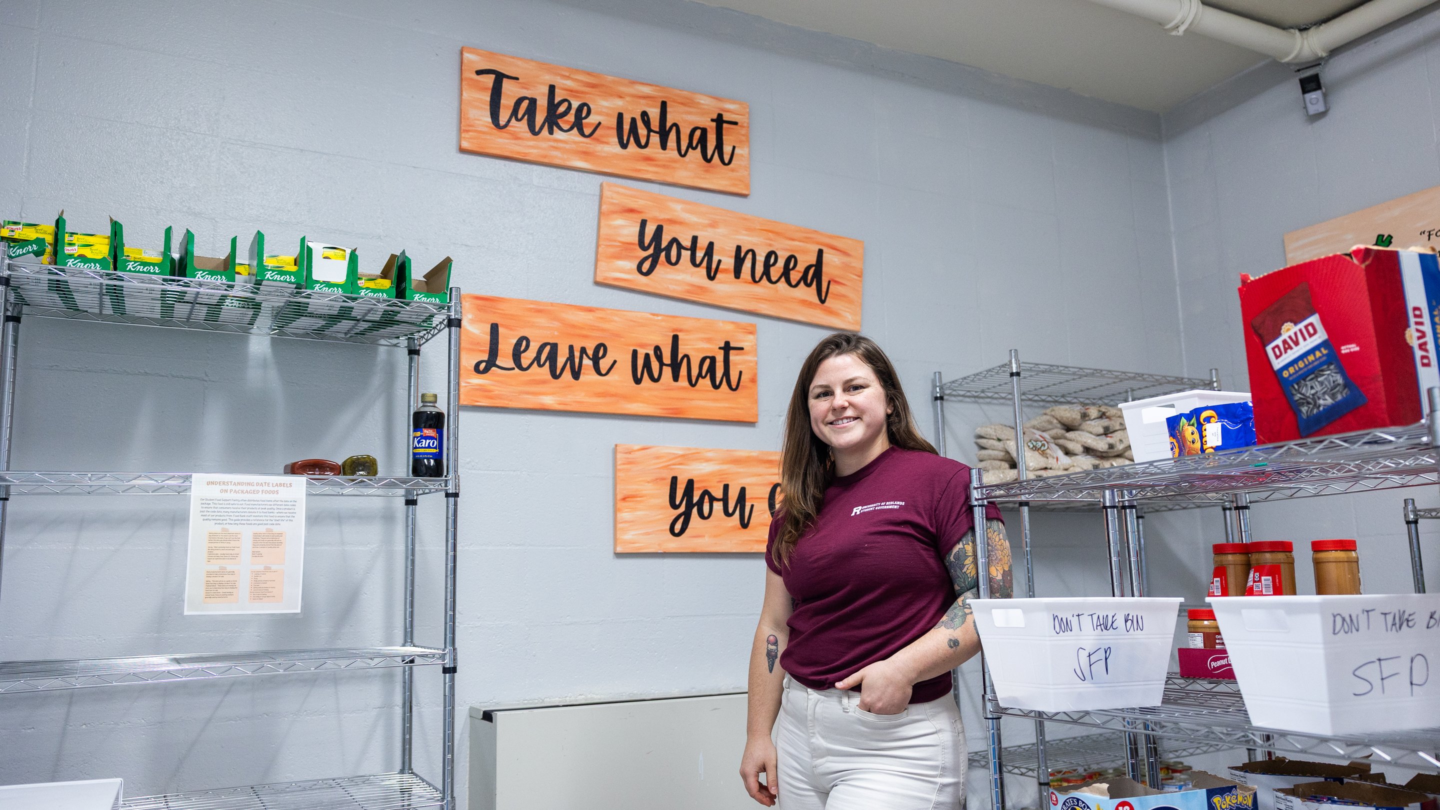a person standing in front of a sign