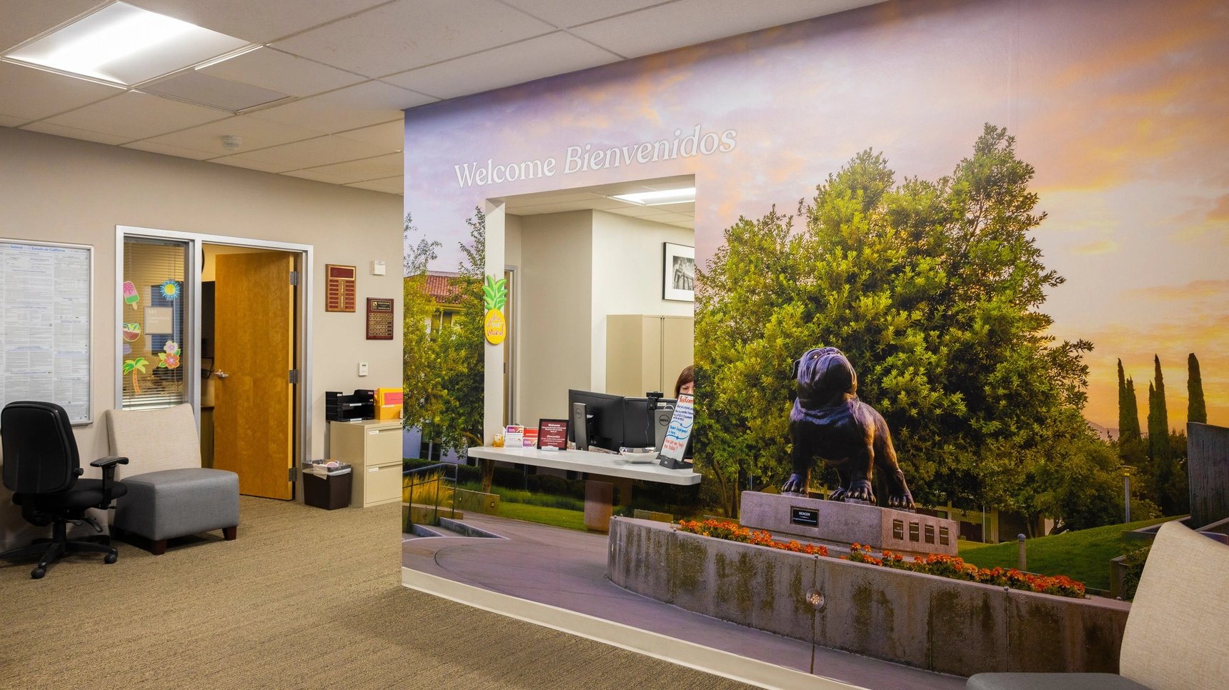 a wall mural of a building with a picture of a reptile