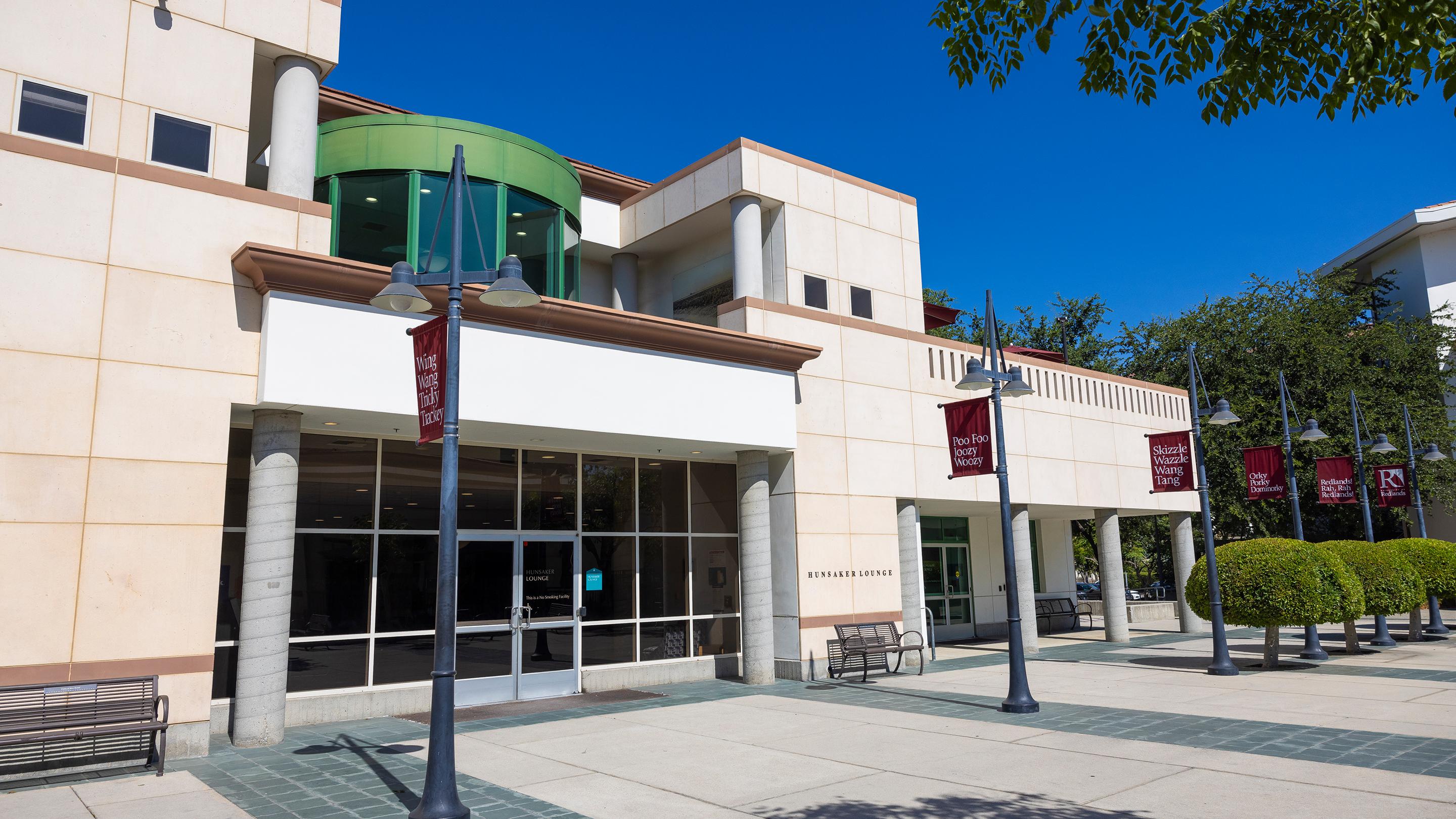 a building with a green and white sign