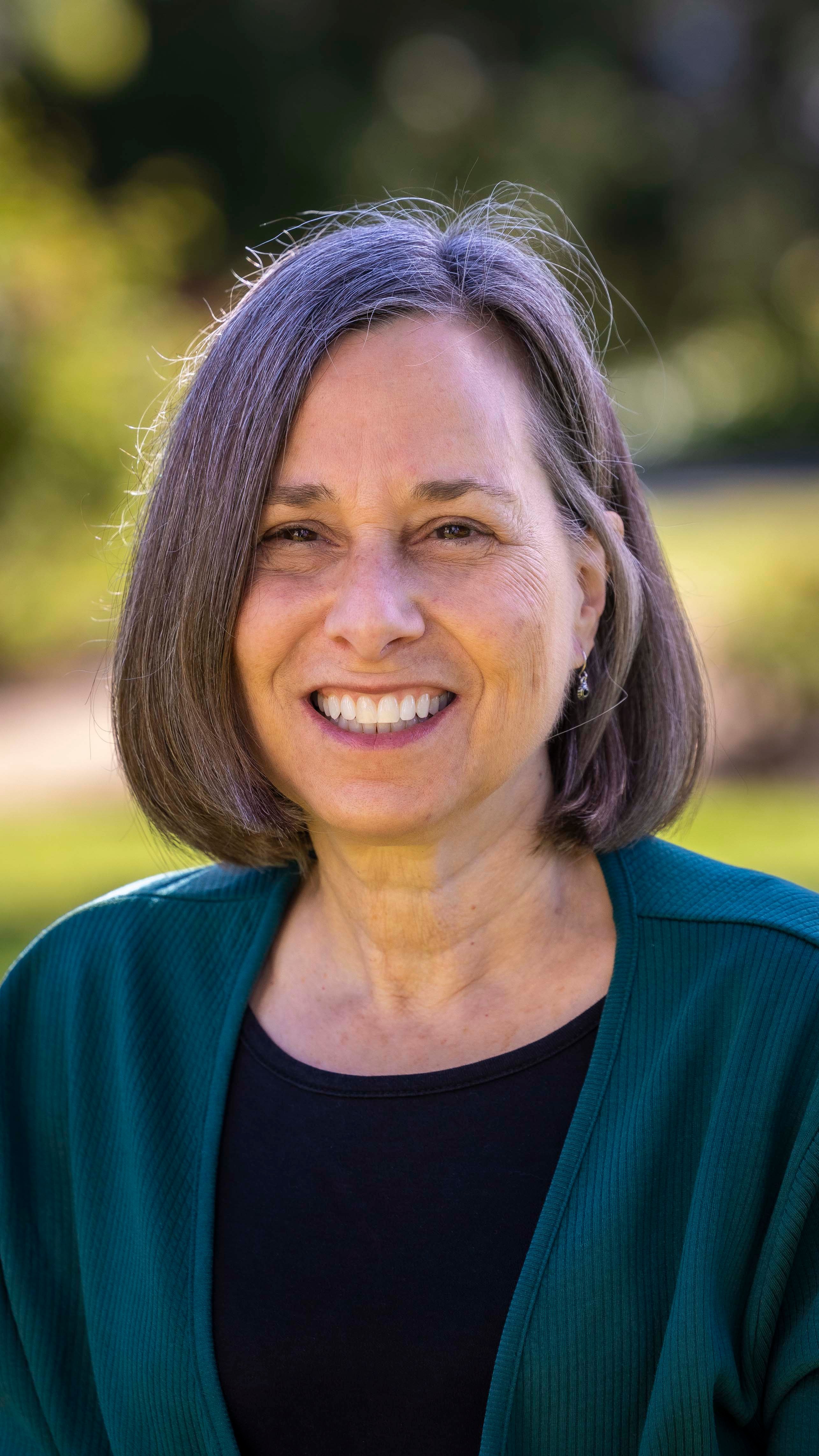 a woman smiling for a picture