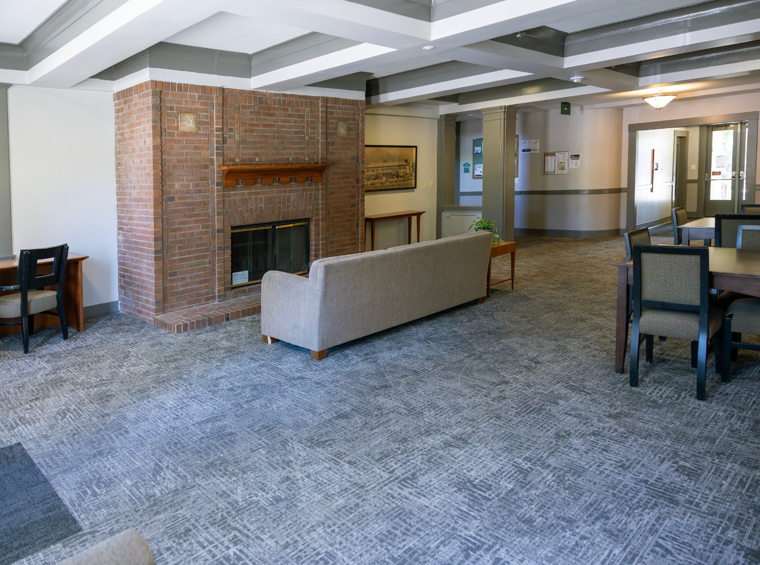 a room with a fireplace and couches