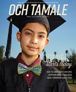 a boy wearing a graduation cap and gown