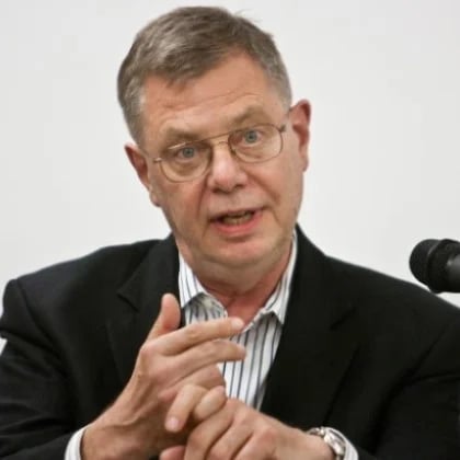 a man in a suit and glasses