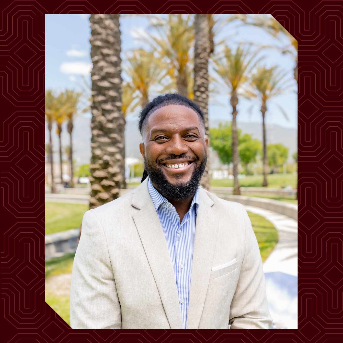a man smiling in a suit
