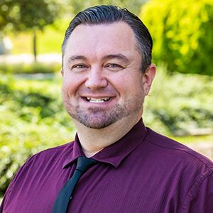 a man in a purple shirt