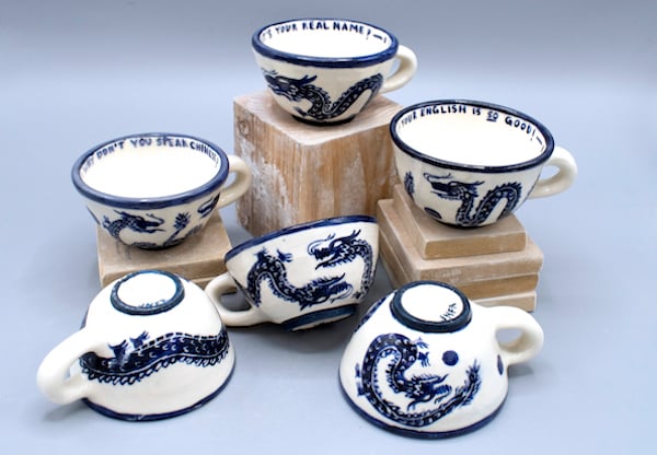 a group of tea cups and teacups