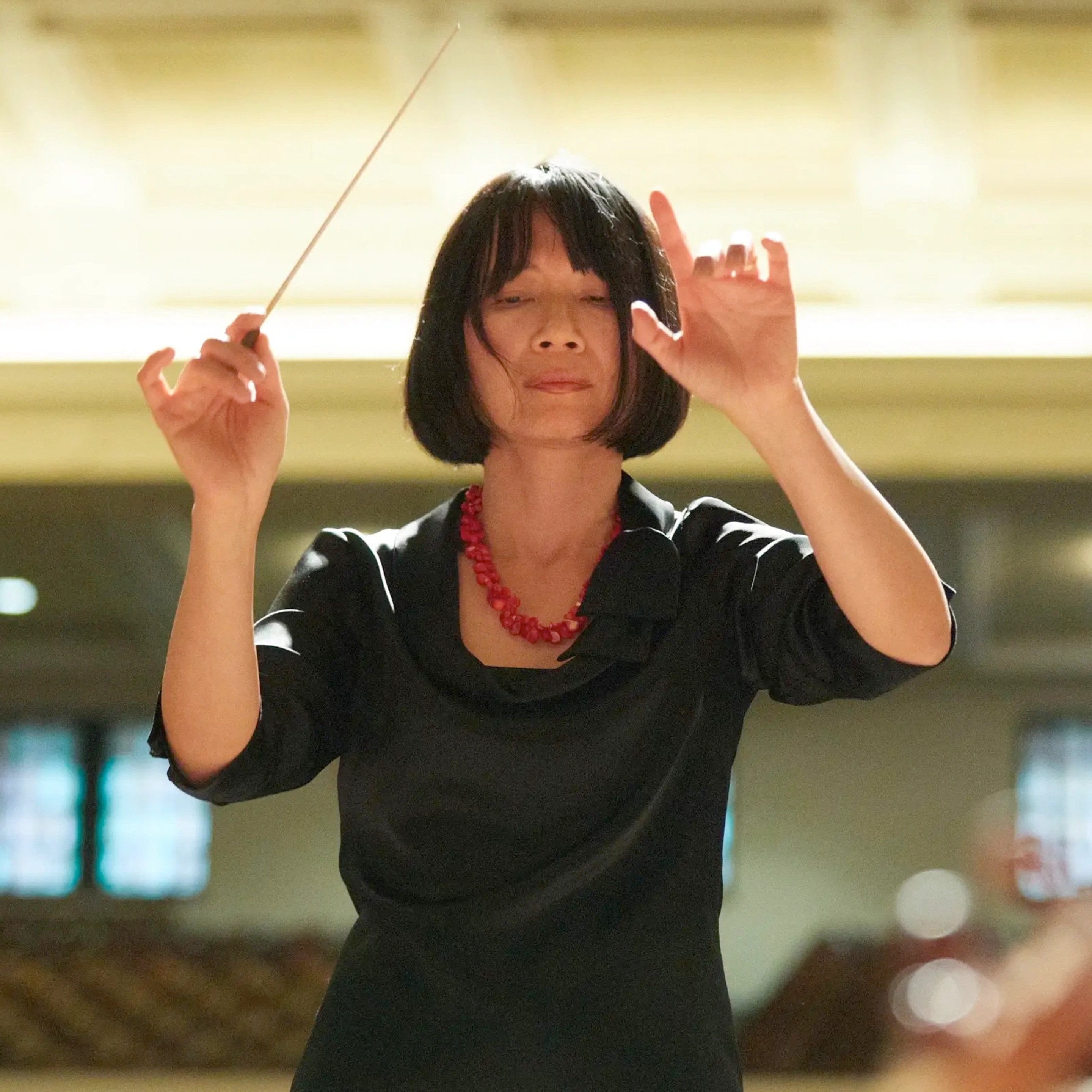 a woman holding a stick