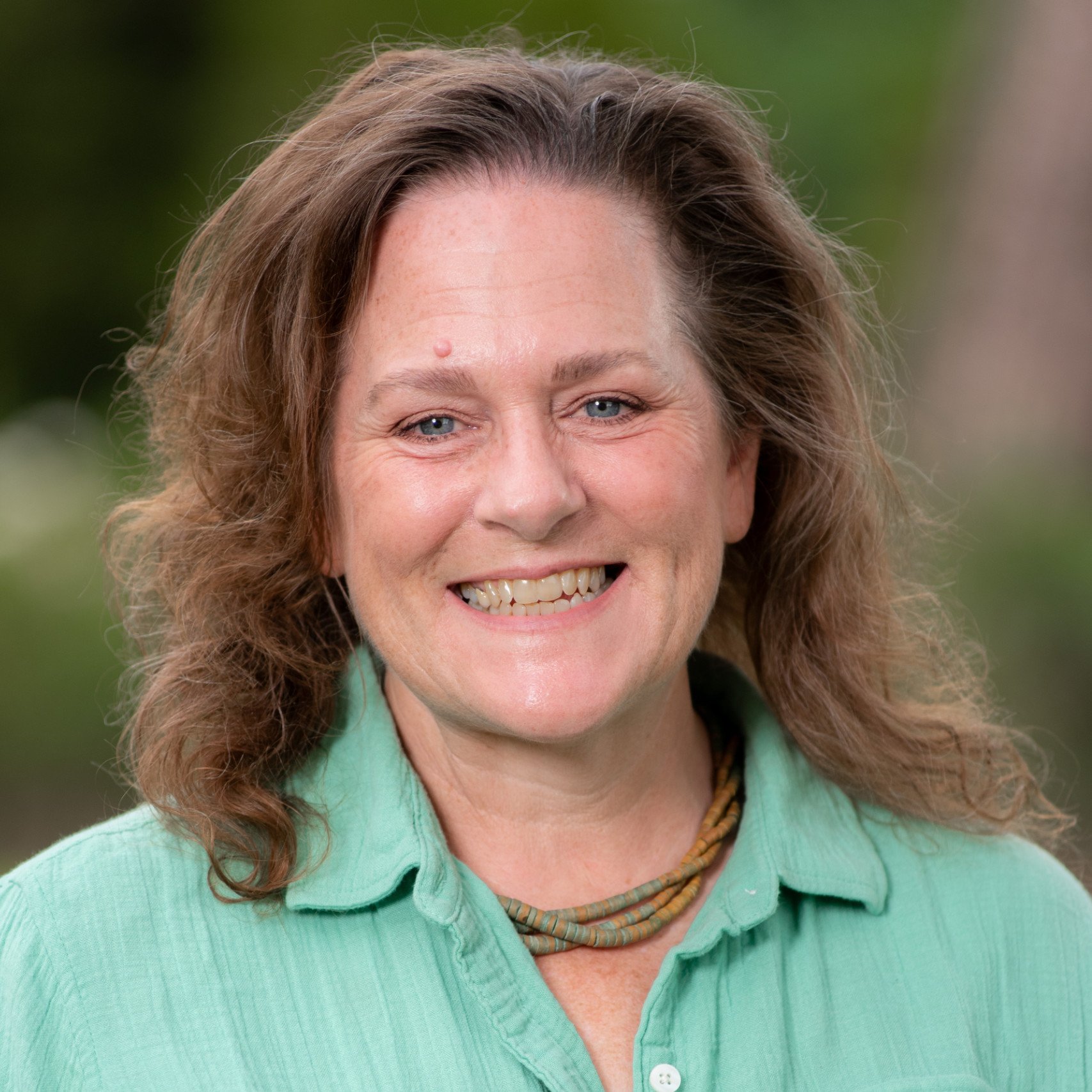 a woman smiling at camera