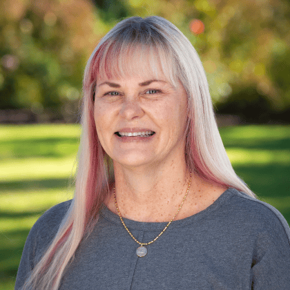 a woman with blonde hair smiling