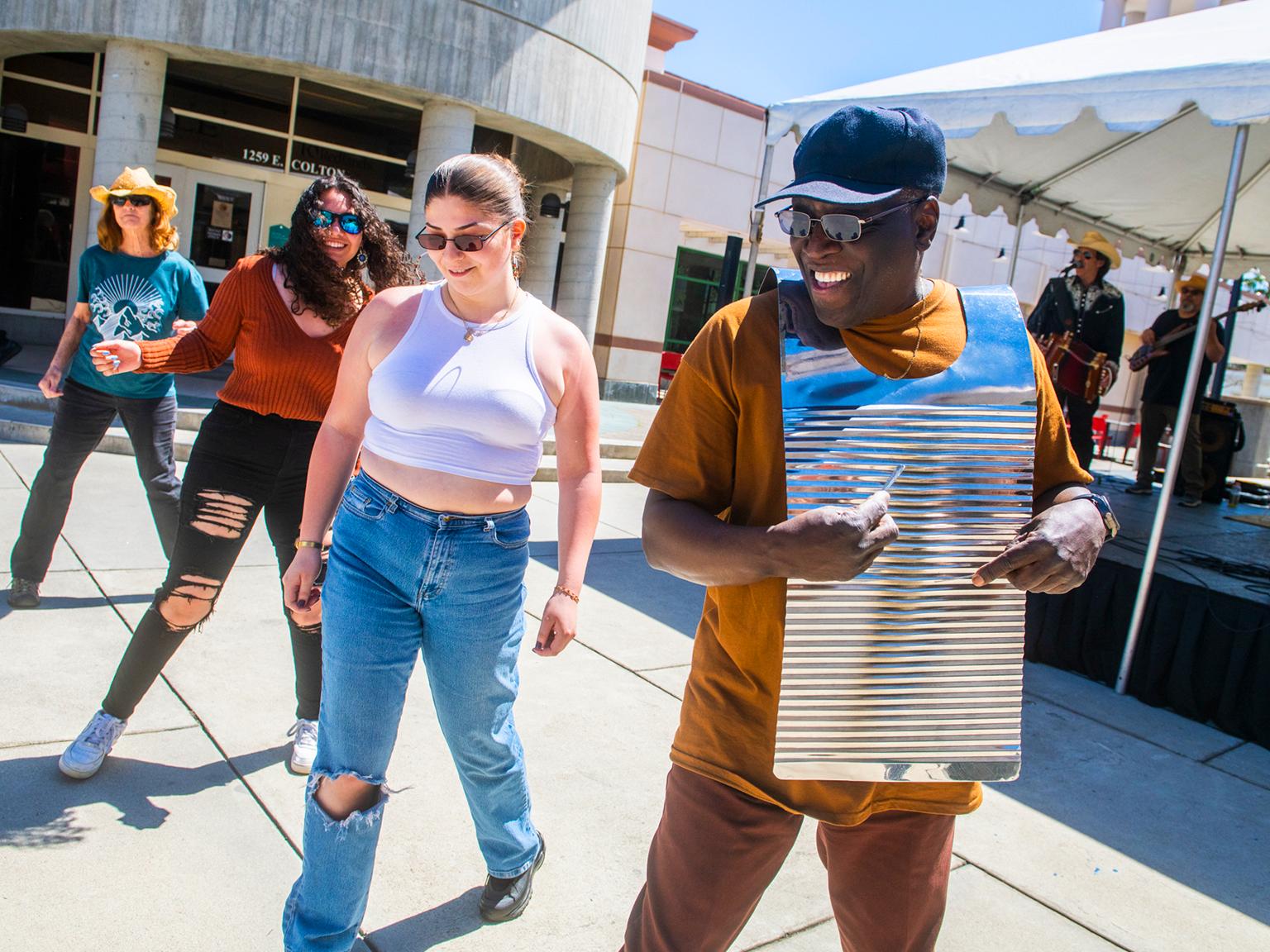 a man in a blue hat and sunglasses with a silver object on it