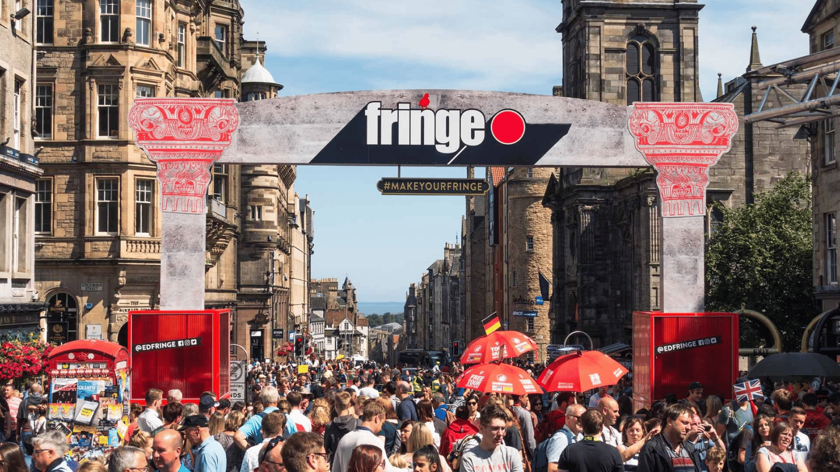 a crowd of people walking in a city