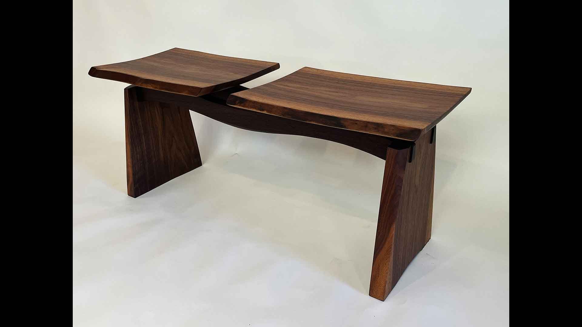 a wooden bench with two sides
