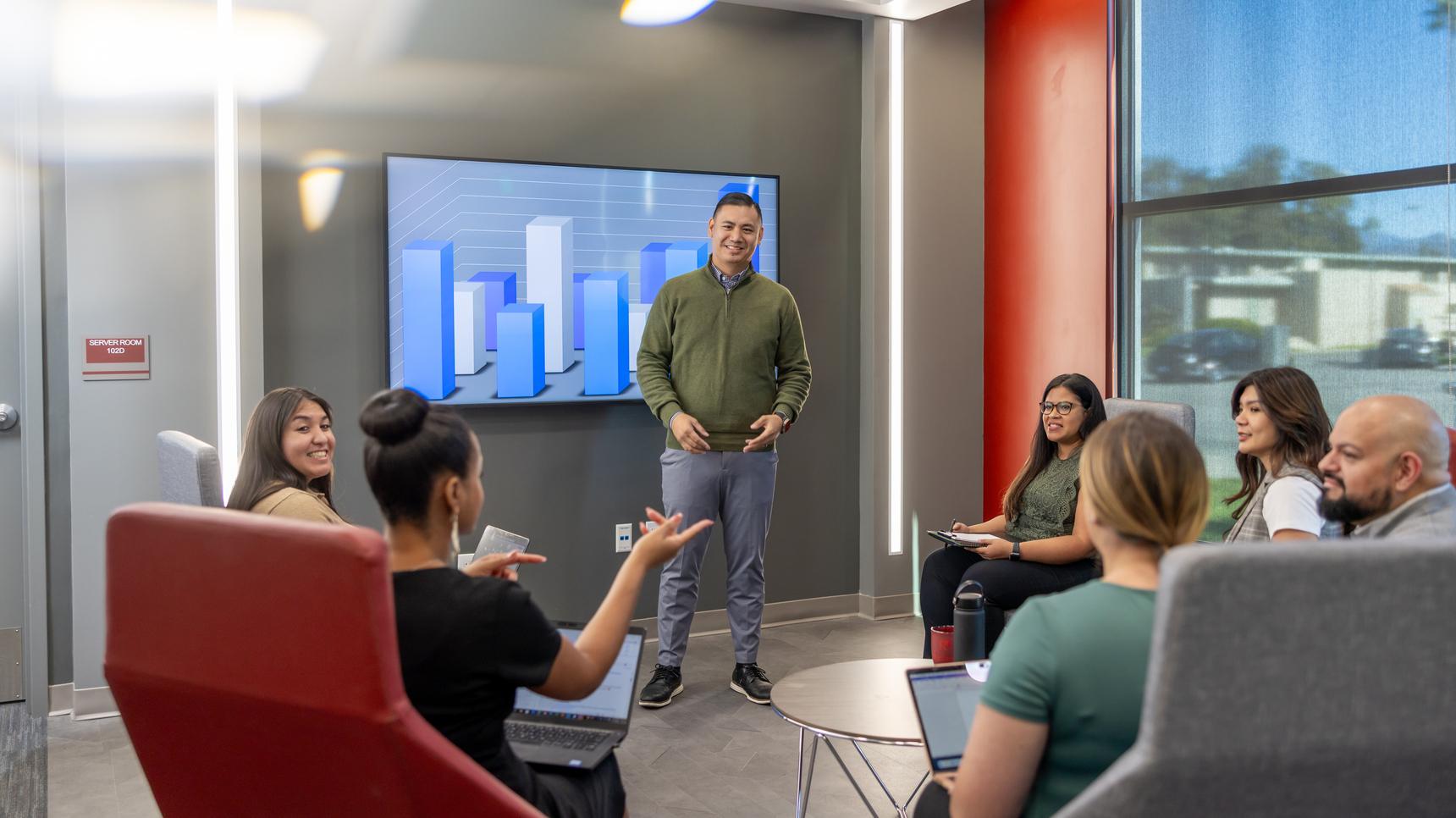 a man standing in front of a group of people