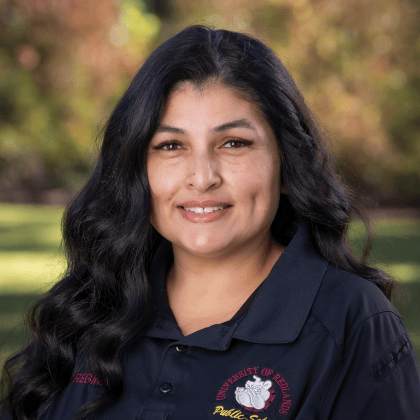 a woman with long black hair smiling