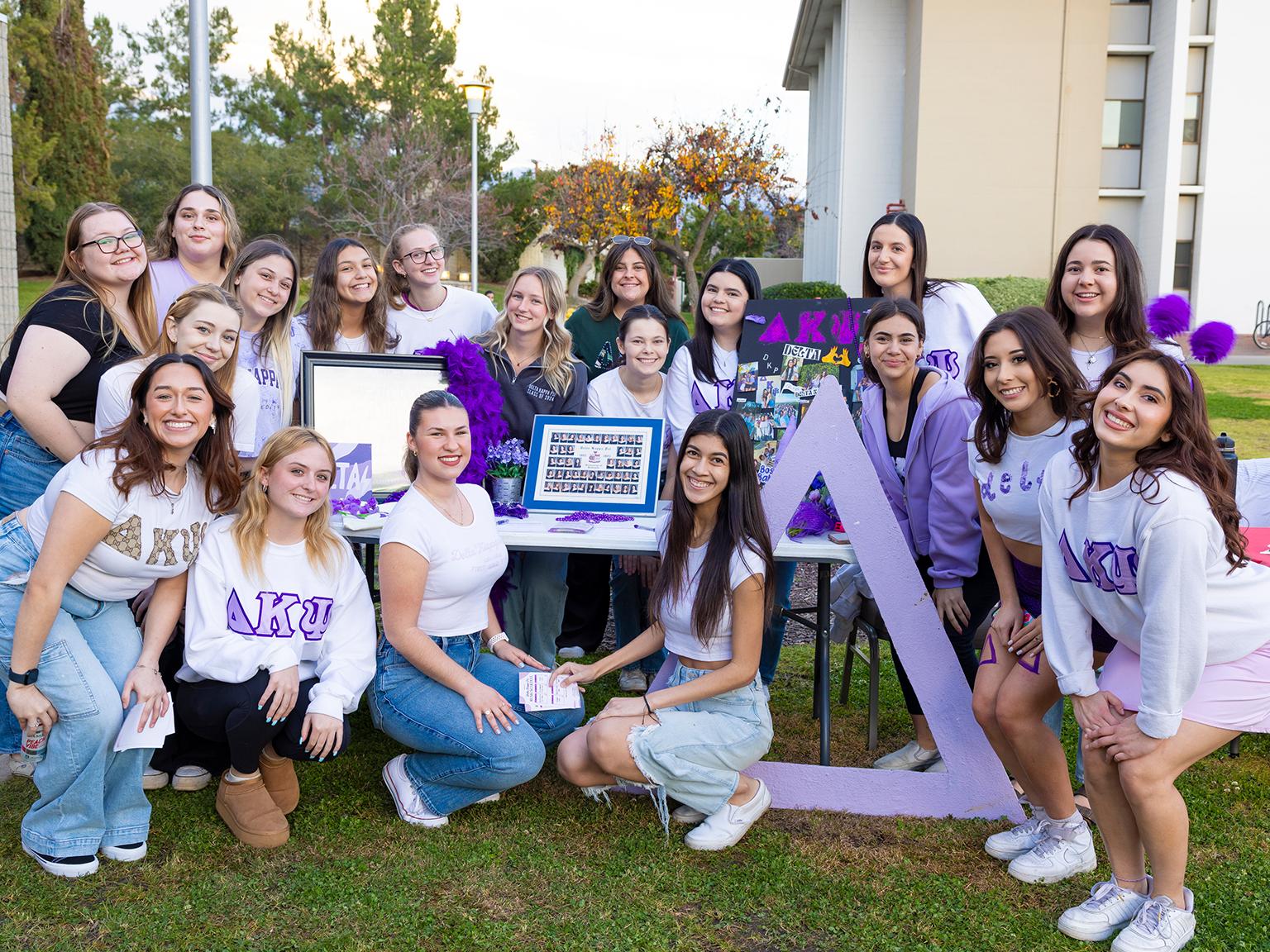 a group of women posing for a photo