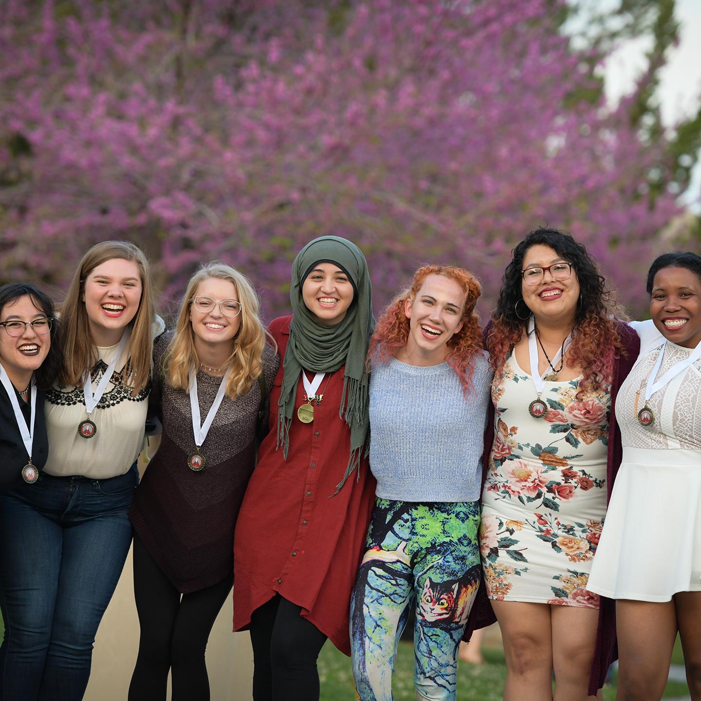 a group of women posing for a photo