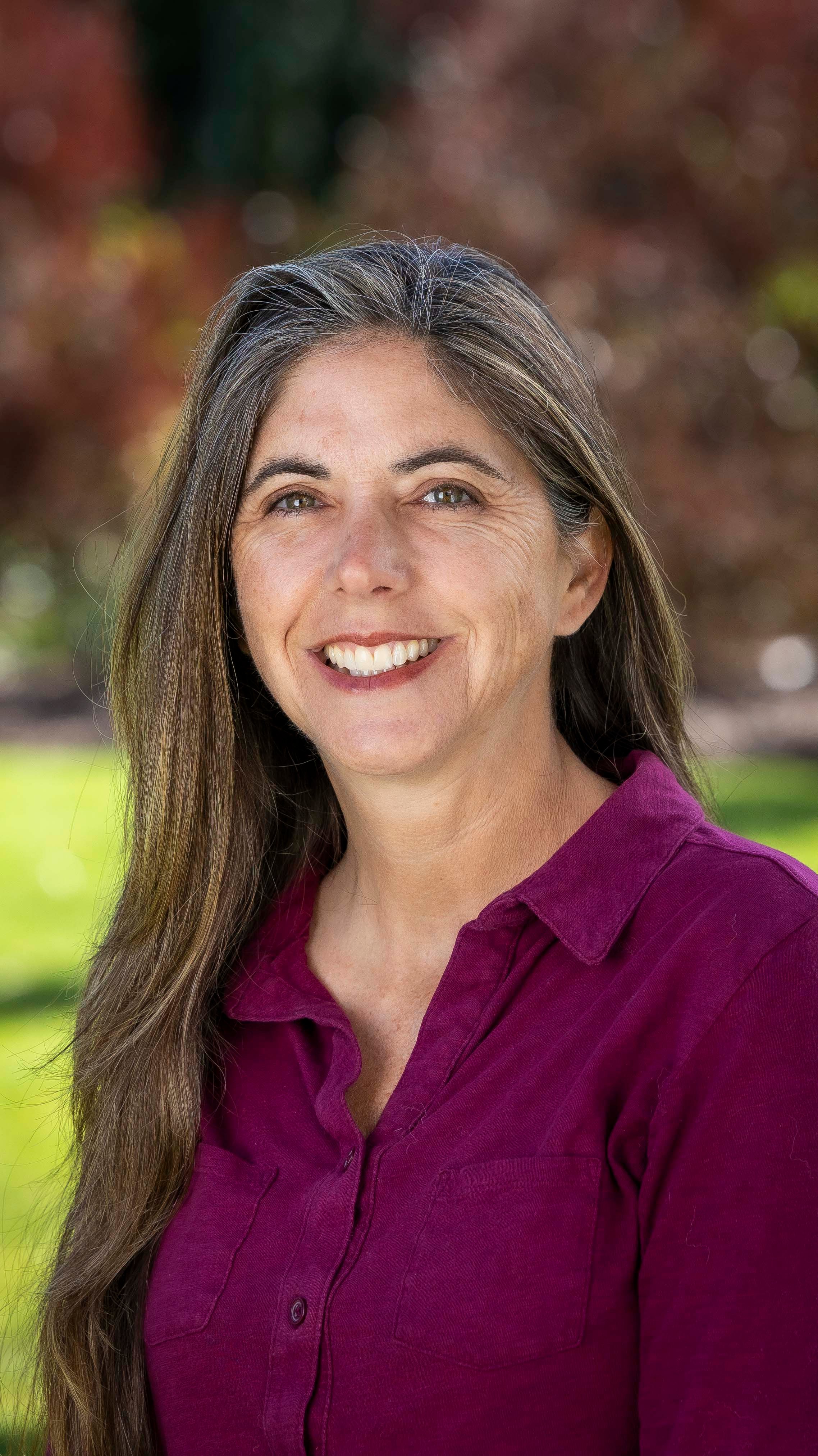 a woman smiling at the camera