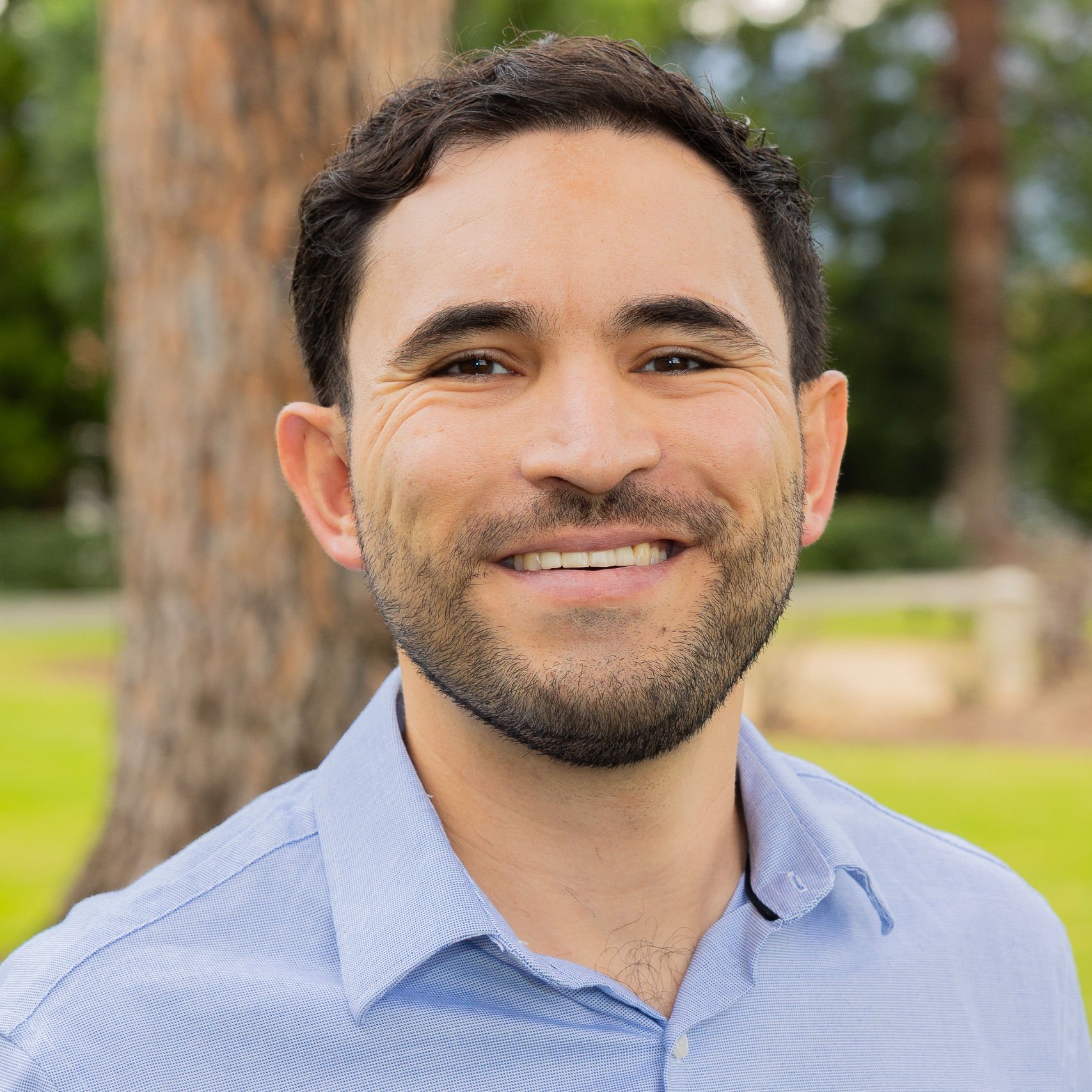a man smiling for a picture