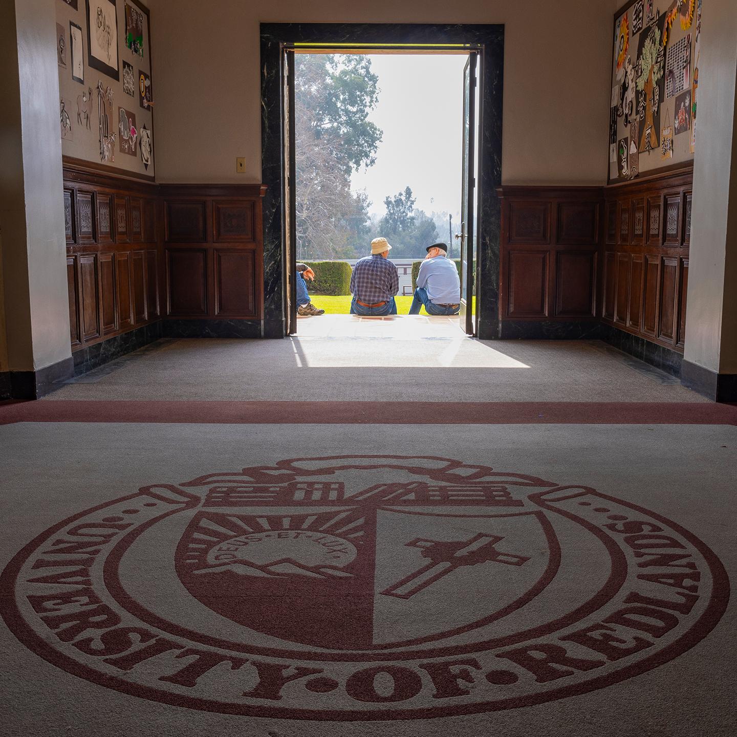 people sitting in a hallway
