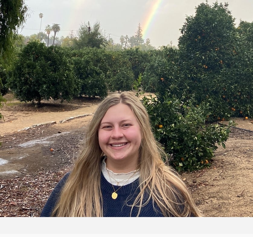 a woman smiling at the camera