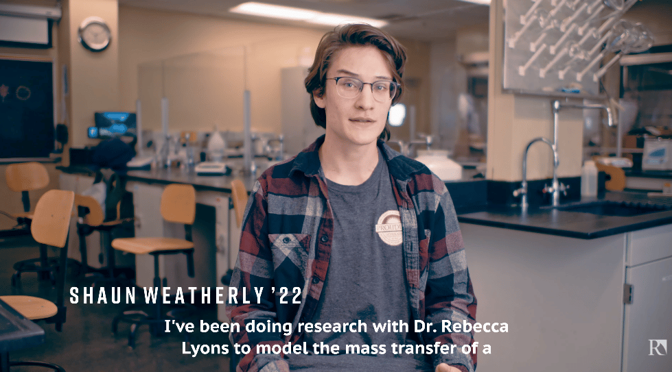 a man in a room with a science lab